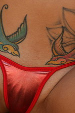 Tattoed chippy in hot red bikini  01