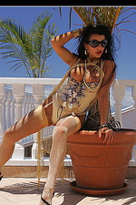 Eve posing nude at the balcony 04