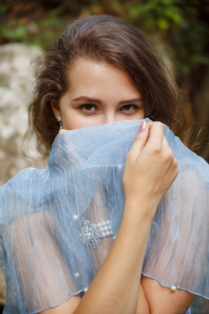 Cute brunette Ava is an enchanting forest nymph in a diaphanous robe that shows her sweet pink nipples.