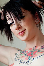 Tattooed Goth girl shows off her corset 13