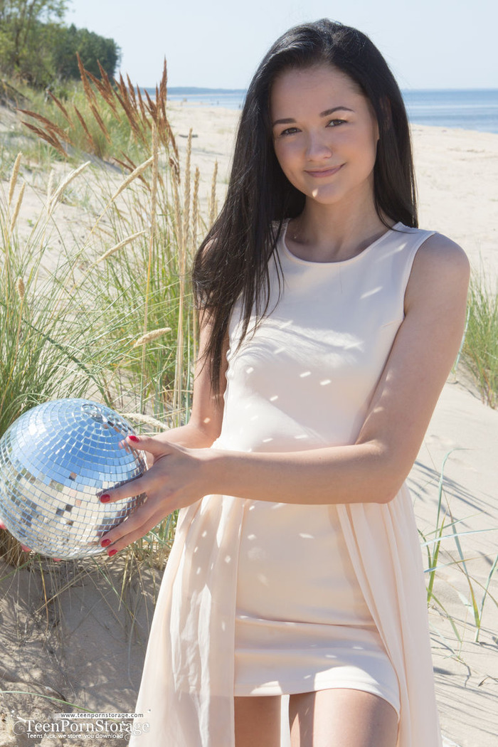 Lovely Teen Olivia Strips On The Beach