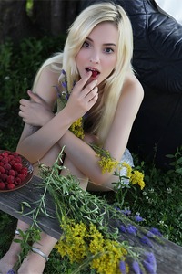  she devours a succulent raspberry between her luscious lips